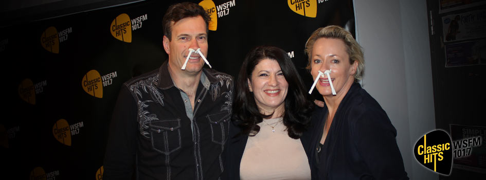 WSFM Radio Hosts Jonesy and Amanda with Nad's Nose Wax in their nostrils standing with Sue Ismiel